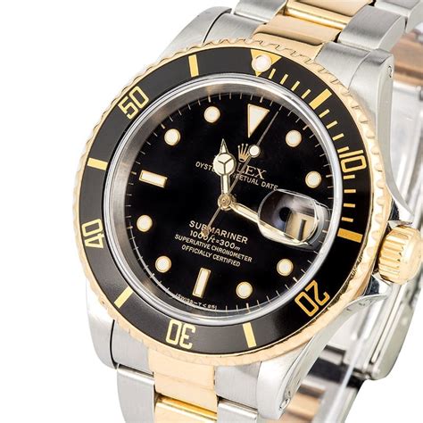 black and gold rolex submariner